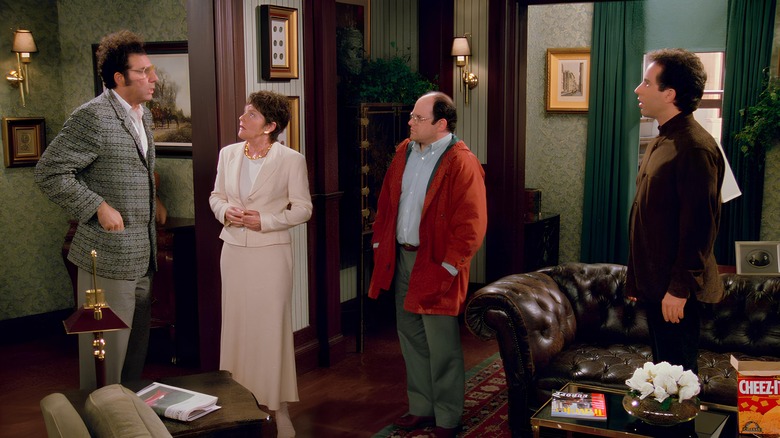 Realtor, George, and Jerry looking at Kramer