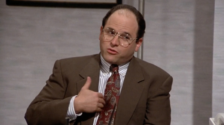 George Costanza wearing a red tie