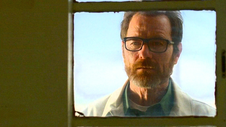 Walter White peers through window