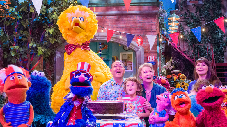 The Sesame Street residents celebrate