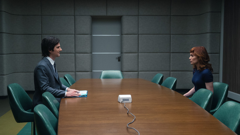 Mark and Helly sit across the table from one another