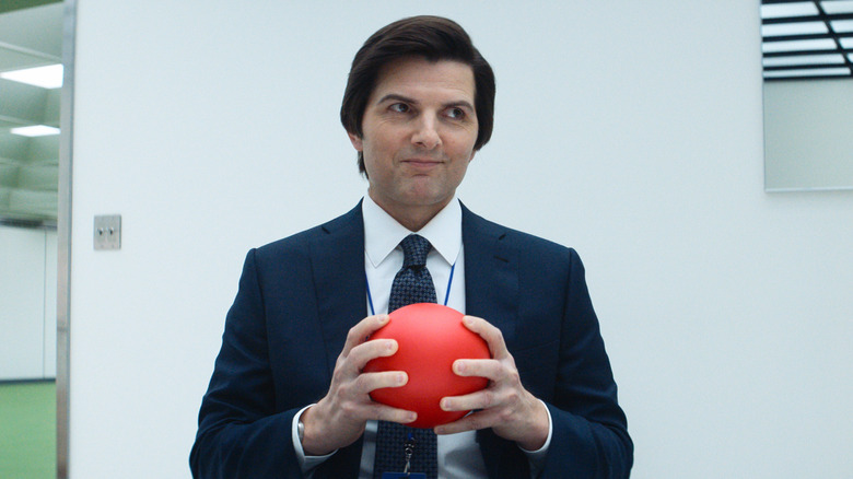 Mark S. holding a red ball and smirking (2025)