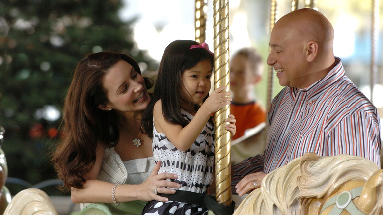 Harry Charlotte and Lily on carousel