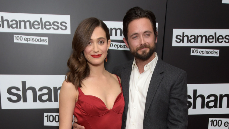 Emmy Rossum and Justin Chatwin smile at event 