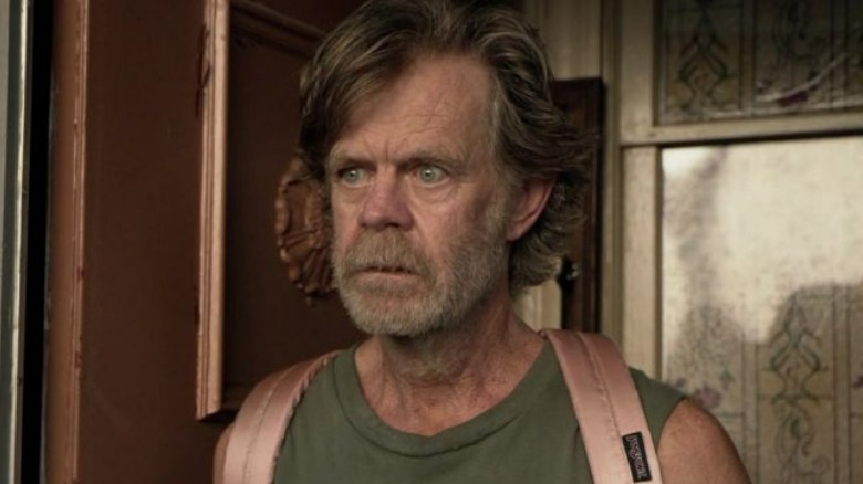 Frank Gallagher wearing a backpack