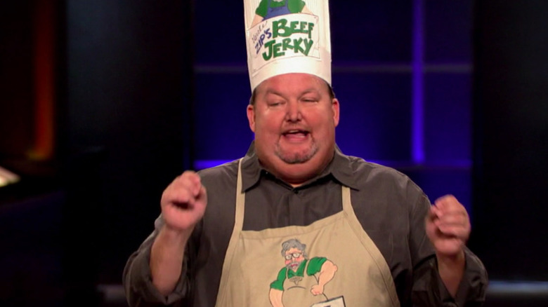 Ken Howell wears chef's hat