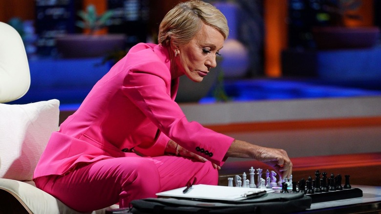 Barbara Corcoran looking at a chess set