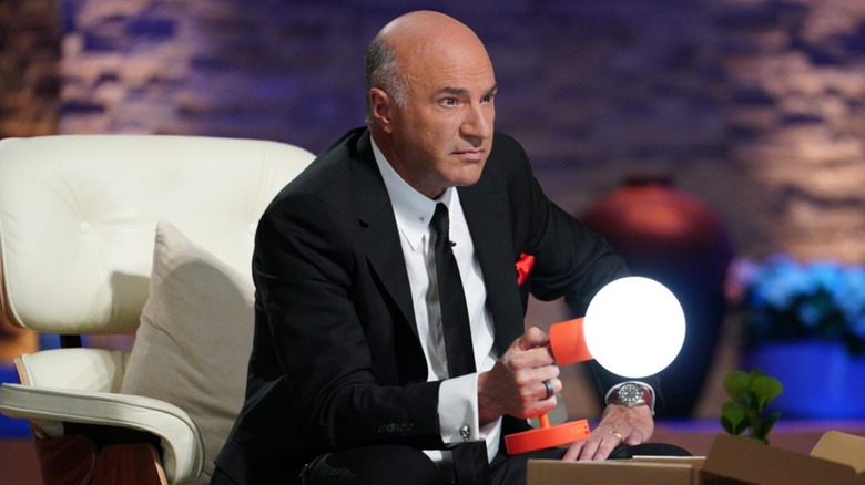 Kevin O'Leary holding a Poplight