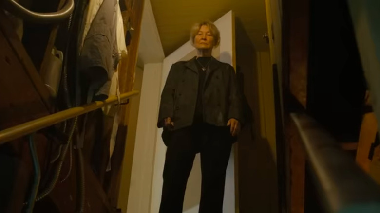 The Coyle matriarch at the top of the basement stairs in Nix