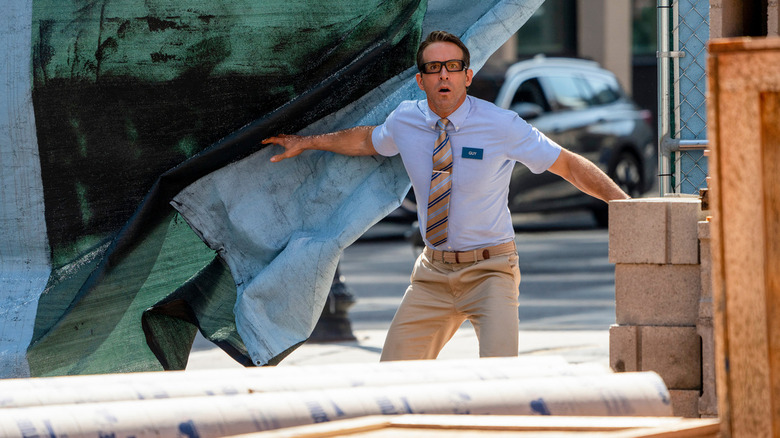 Ryan Reynolds as Guy wearing glasses in Free Guy