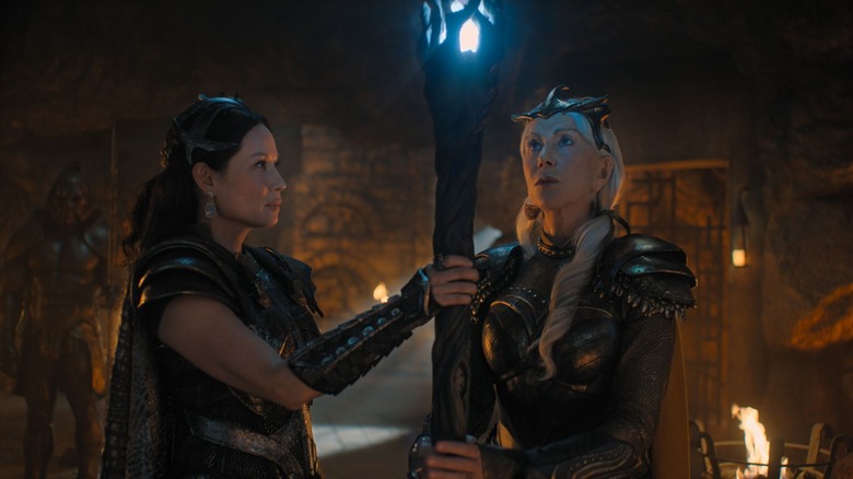 Hespera and Kalypson holding onto magic staff