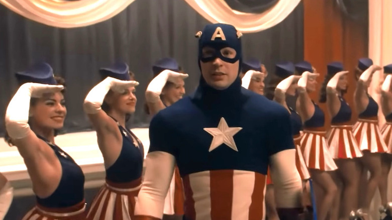 Captain America on stage in front of dancers