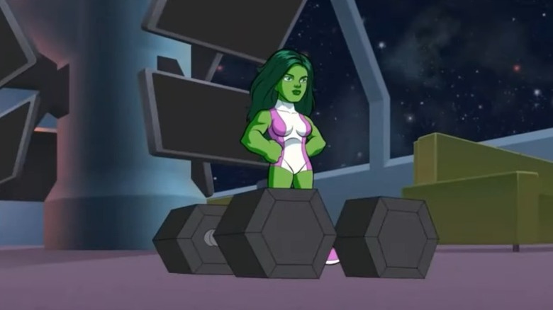 She-Hulk standing next to two dumbbells