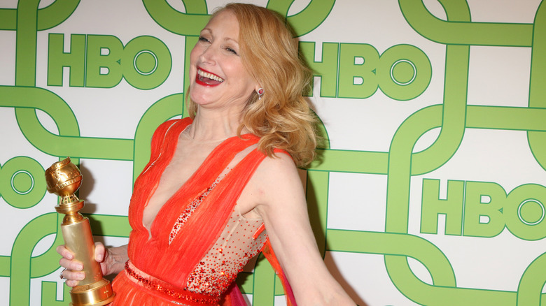 Patricia Clarkson holding a Golden Globe