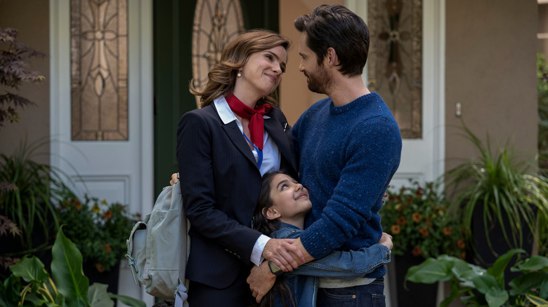 Lisa smiling with Neil and Emma