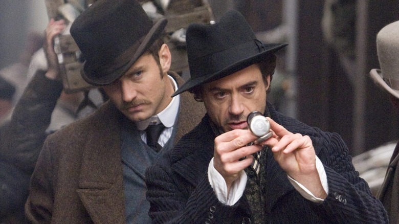 Watson and Holmes study a timepiece