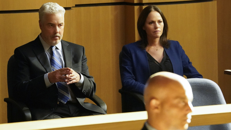 Gil Grissom and Sara Sidle sitting