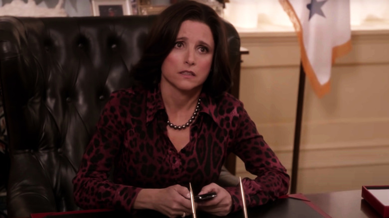 Julia Louis-Dreyfus concerned at desk