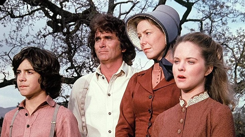 The Ingalls-Wilders in front of tree