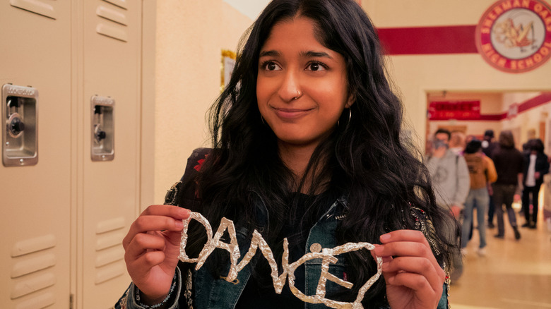 Davi smiling and holding a "dance" sign