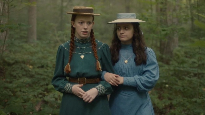 Anne and Diana walk through woods