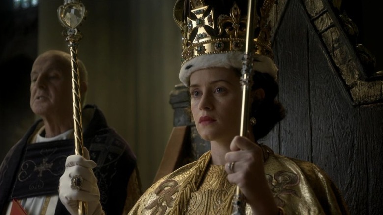 Queen Elizabeth holding golden scepters