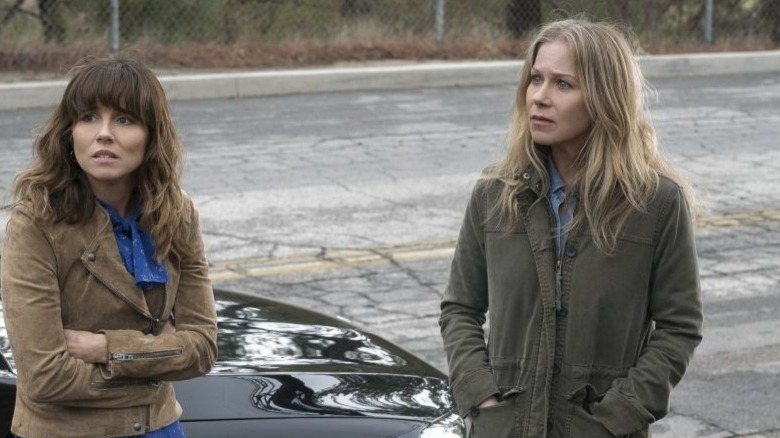 Judy and Jen beside car