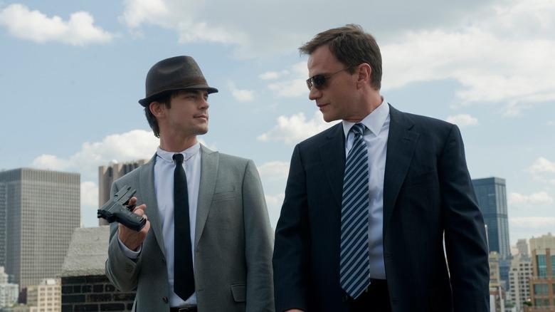 Neal Caffrey Peter Burke staring