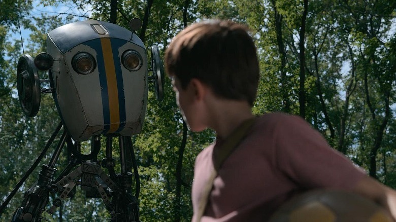 A robot looks upon Cole