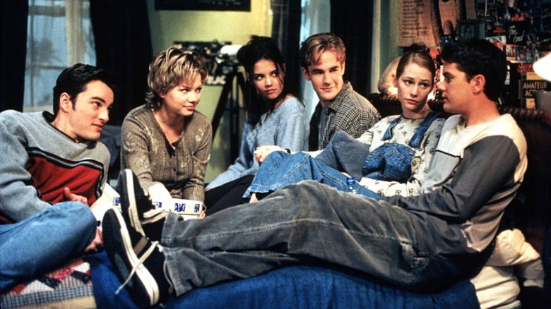 Dawson's Creek cast sit together on a bed