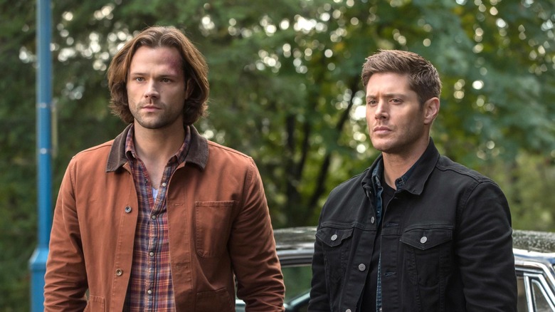 Jensen Ackles and Jared Padalecki stand side-by-side in Supernatural