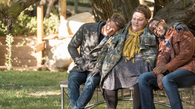 This Is Us cast sits on a bench
