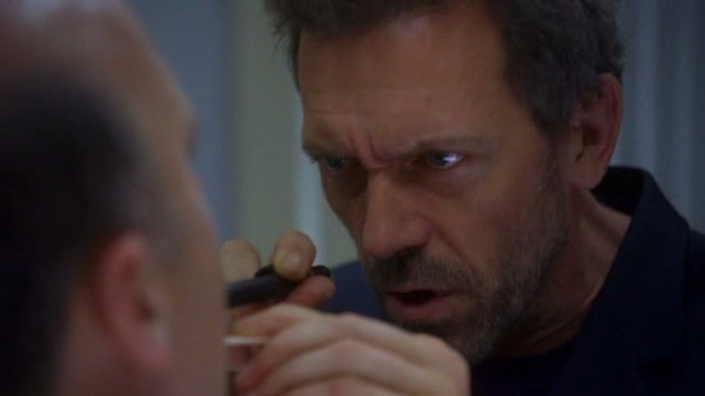 Gregory House examines patient