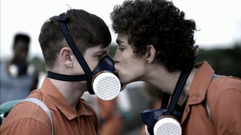 Nathan kissing Simon's gas mask