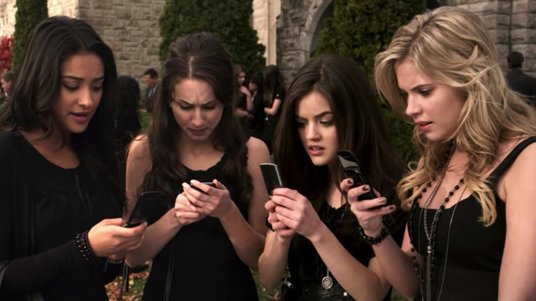 The liars in black all look at their phones