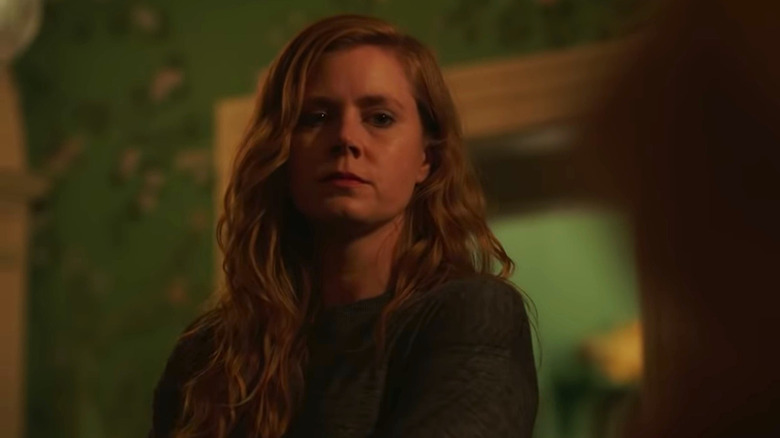 Amy Adams as Camille Preaker returning to her childhood home in Sharp Objects