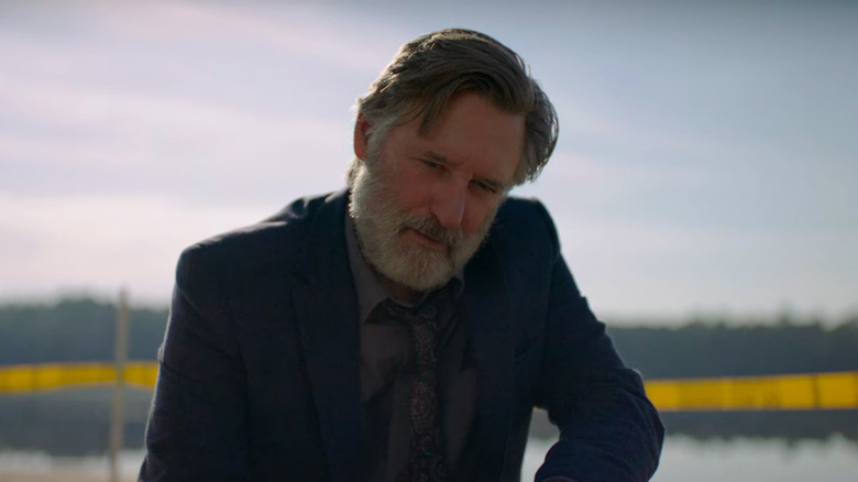 Bill Pullman examines evidence in The Sinner