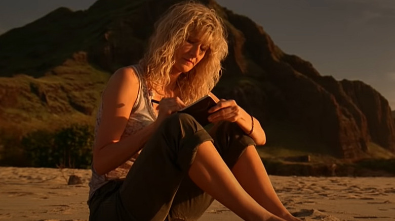 Amy Jellicoe journaling on beach