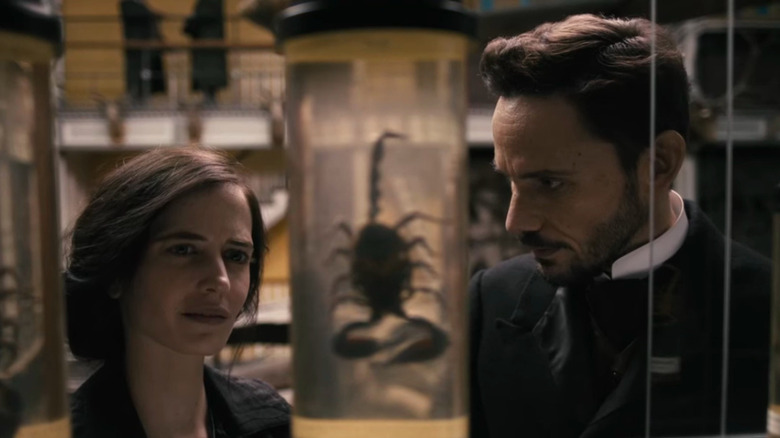 Vanessa and Dracula consider a sample of a scorpion on Penny Dreadful