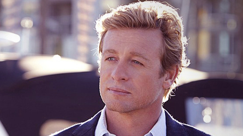 Simon Baker looks left