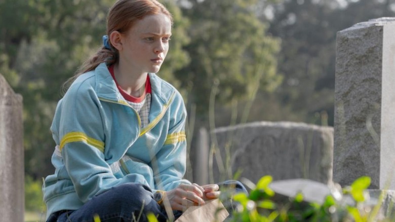 Max at her brother's grave