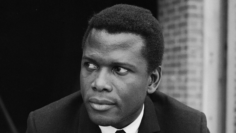 Young Sidney Poitier looks off to side