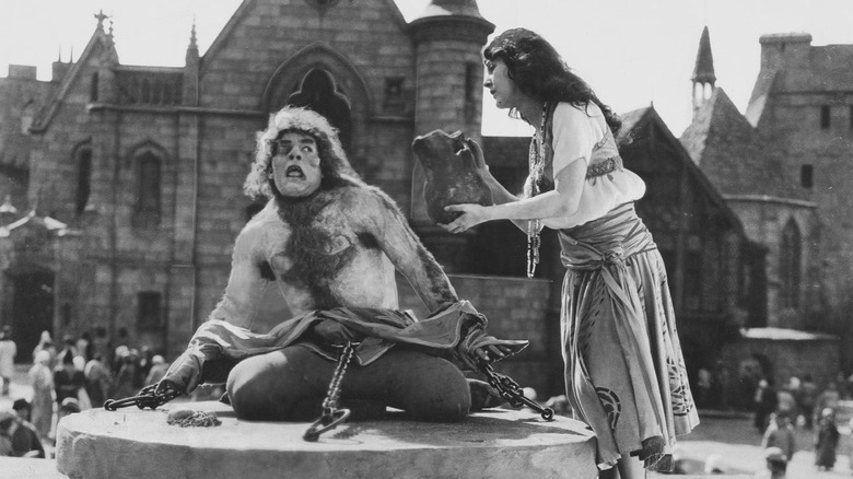 Quasimodo being given water by Esmeralda