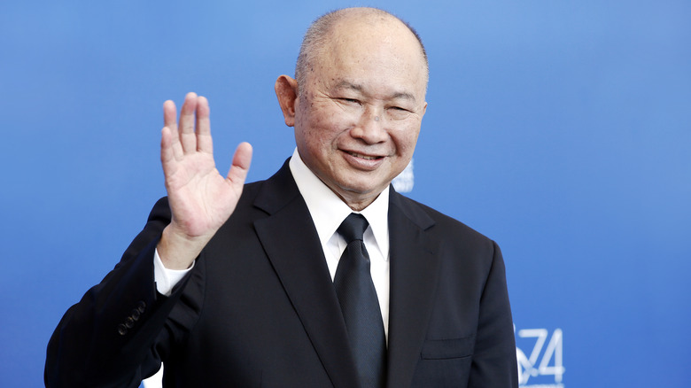 Director John Woo waving