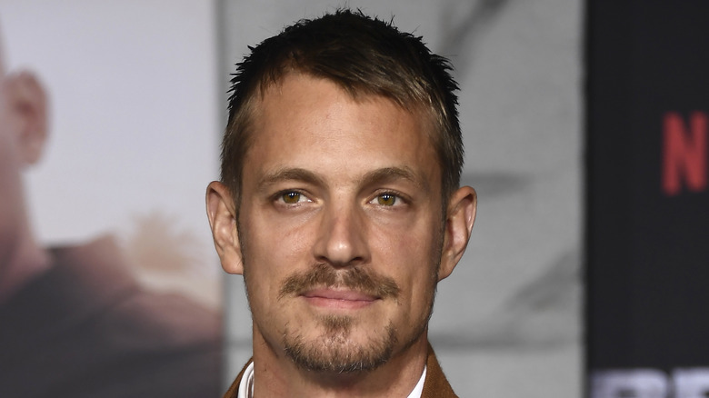 Joel Kinnaman smiling at event