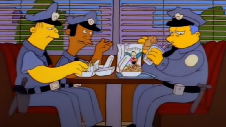 Simpsons police officers with bugers