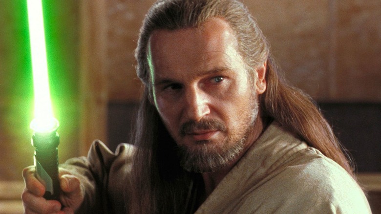 Qui-Gon Jinn holding lightsaber