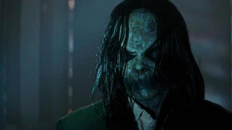 The Bughuul demon standing in a room in Sinister 2