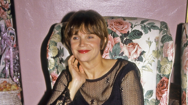 Cindy Williams smiling in an armchair