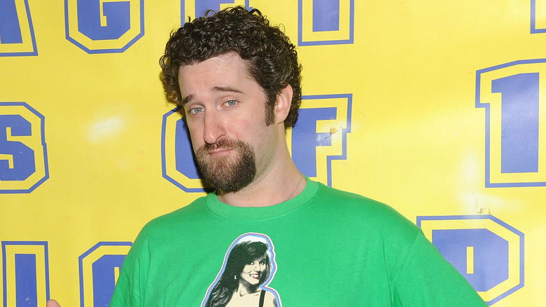 Dustin Diamond in front of yellow wall